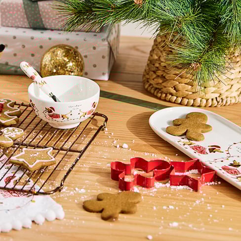 Decorating Christmas themed cookies.