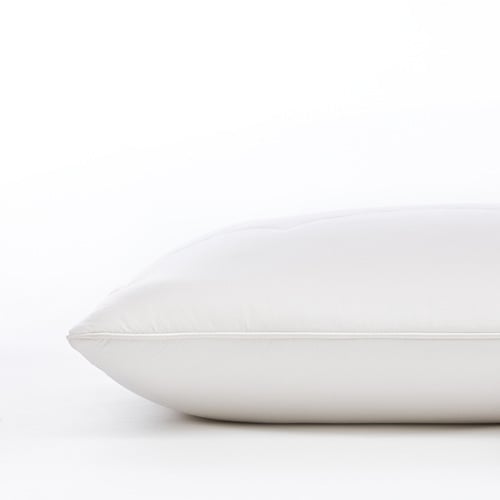 Wool pillow sitting on top of a white table. 