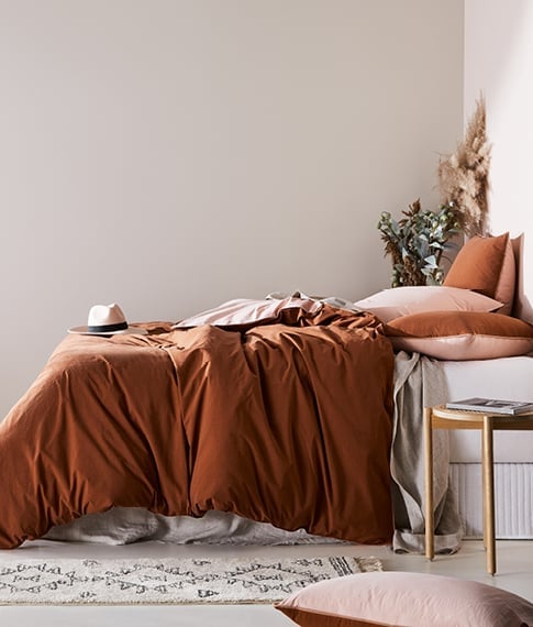 bed with pillows and sheets in a stonewashed cotton in a brown colour set