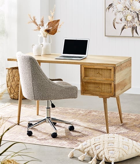 Study with Anjuna Natural Desk and Desk Chair, siting on top of a large rug styled with neutral colours. 
