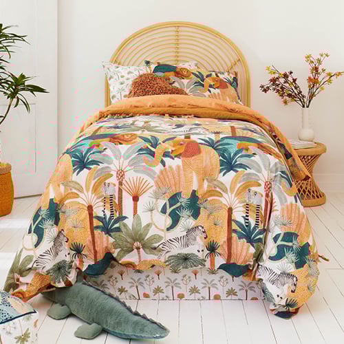 Karina Jambrak x Adairs Kids bedlinen with matching accessories and rattan bedhead and side table.