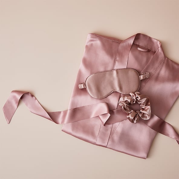 mothers day pyjamas in silk pink with matching eye shades.