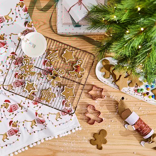 Christmas themed gingerbread cookies fresh out of the oven.