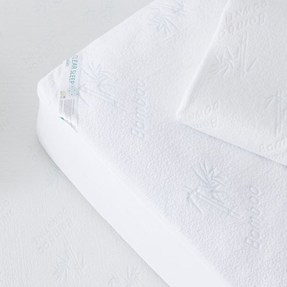 Bird’s eye view of Bamboo Mattress Protector on a bed with a pillow on top with a Bamboo Pillow Protector. 