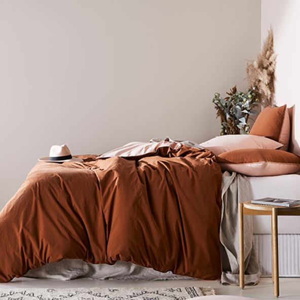 bed with pillows and sheets in a stonewashed cotton in a brown colour set