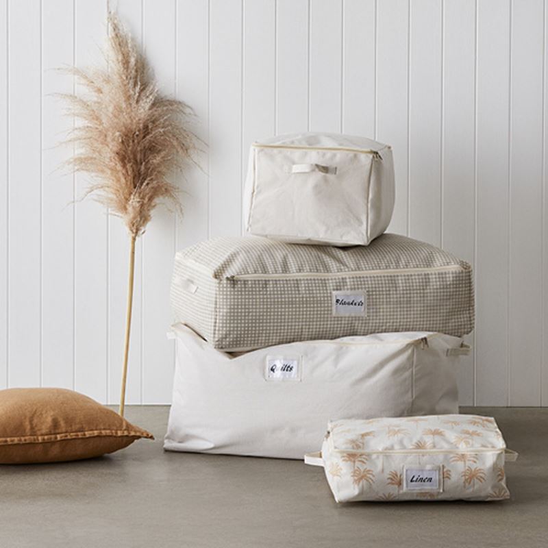 various storage bags in white, beige and floral patterns