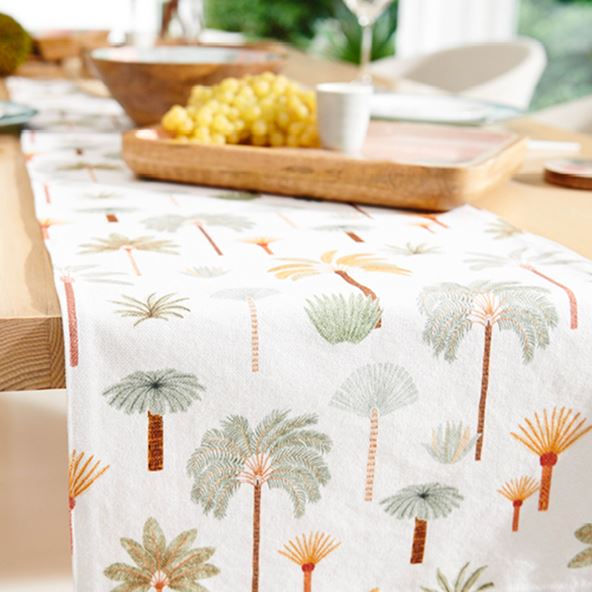 Close-up of dining room table with Karina Jambrak x Adairs Table Runner, styled with matching servingware accessories.