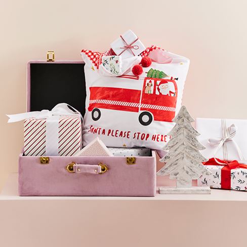 Pink Christmas themed box with red fire engine truck pillowcase.