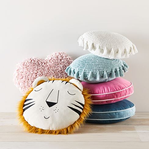 kids set of various cushions stacked on top of one another