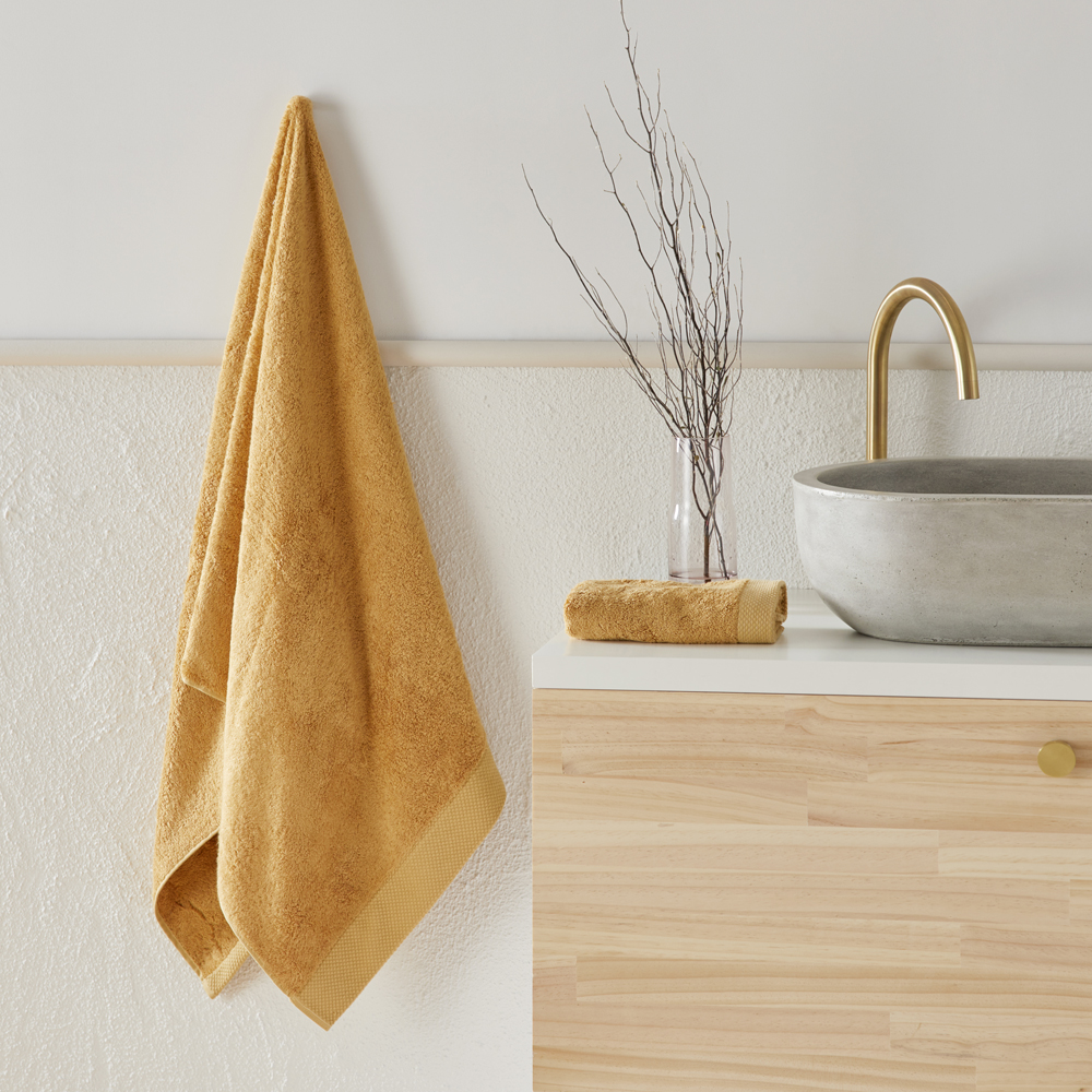 Navara Mustard Solid Bamboo Cotton Towel Range Adairs